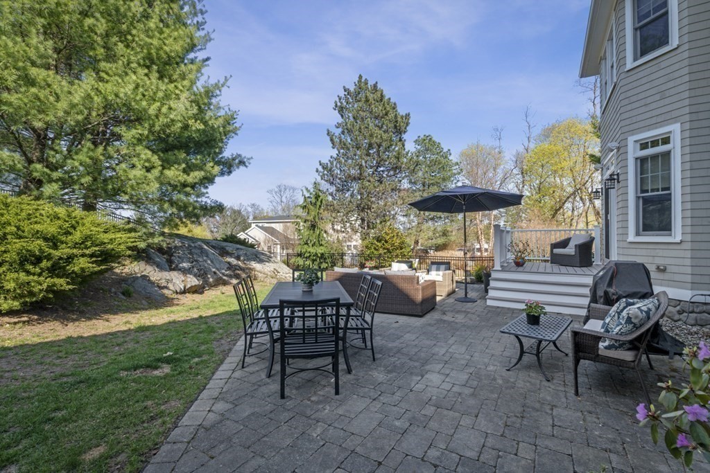6 Captains Walk Lane Marblehead, MA 01945 - Photo 7 of 39 a view of a chairs and table in backyard of the house