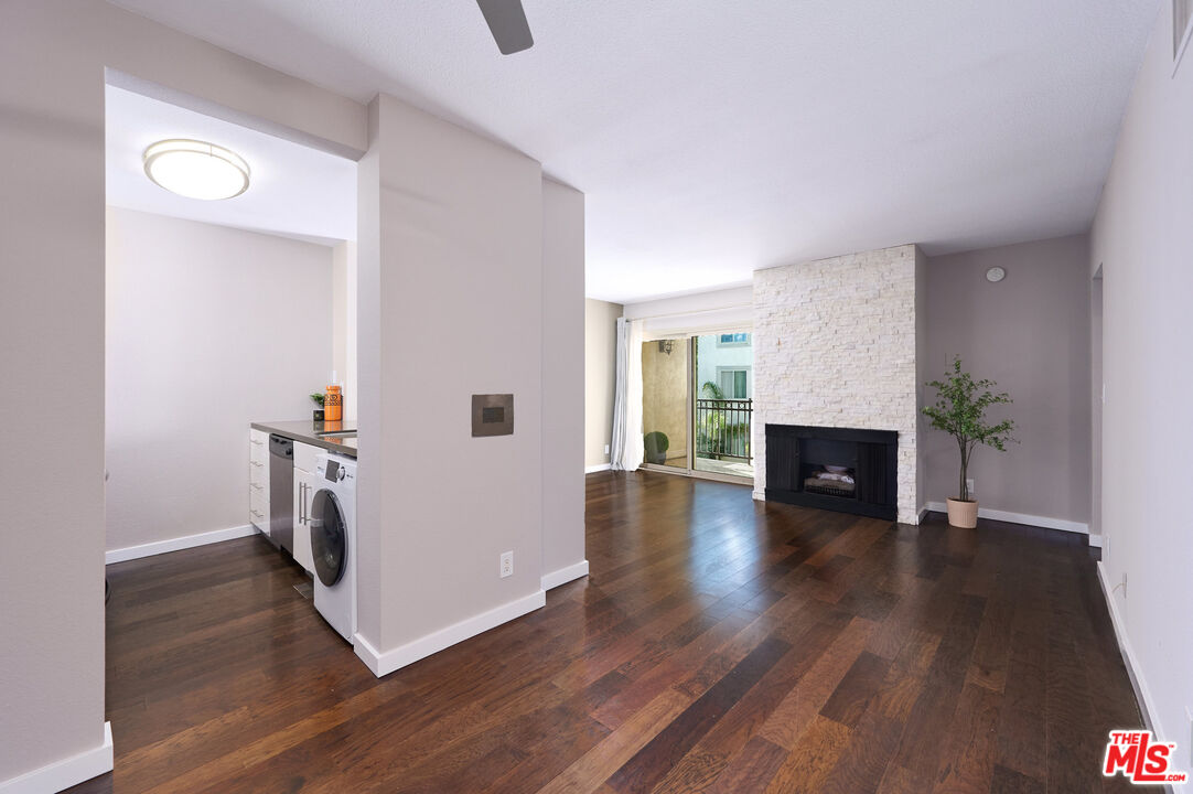 a view of livingroom with hardwood floor and a fireplace