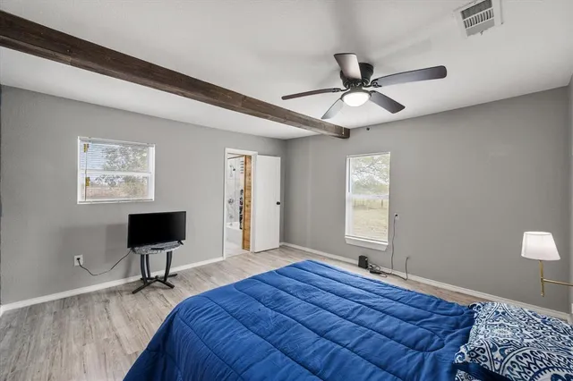 a bedroom with a bed and a table