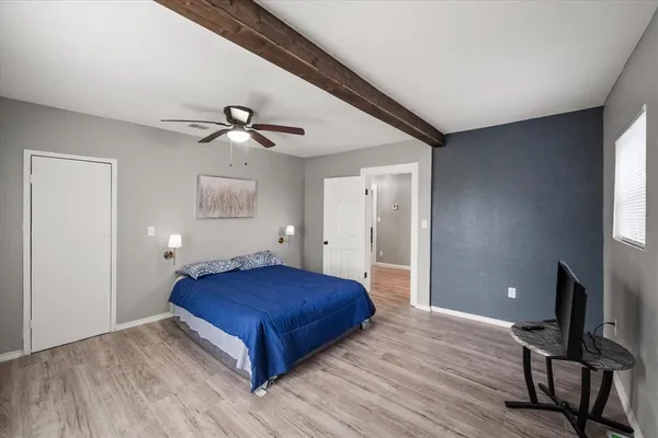 a bedroom with a bed and a table