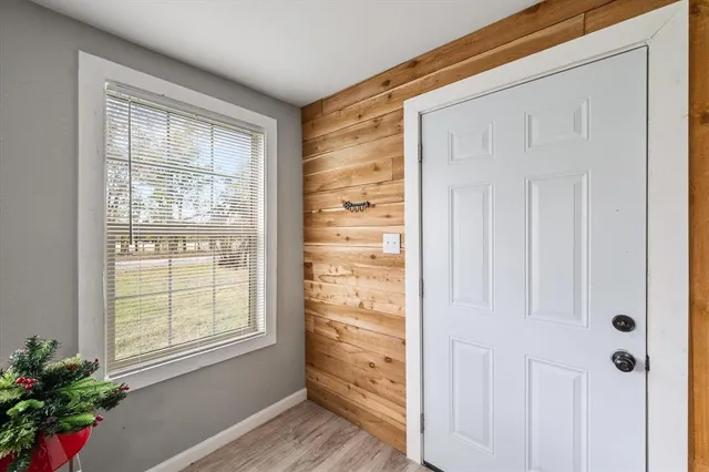 a view of a hallway that has a window in it