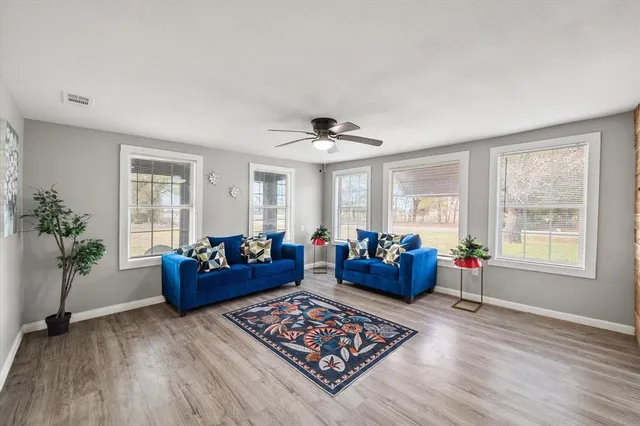 a living room with furniture and a large window