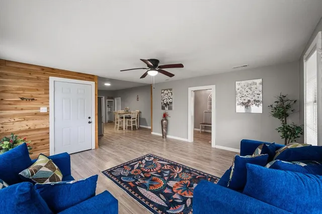 a living room with furniture rug and window