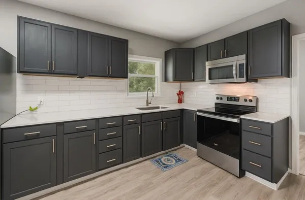 a kitchen with stainless steel appliances granite countertop wooden cabinets a stove top oven a sink and dishwasher