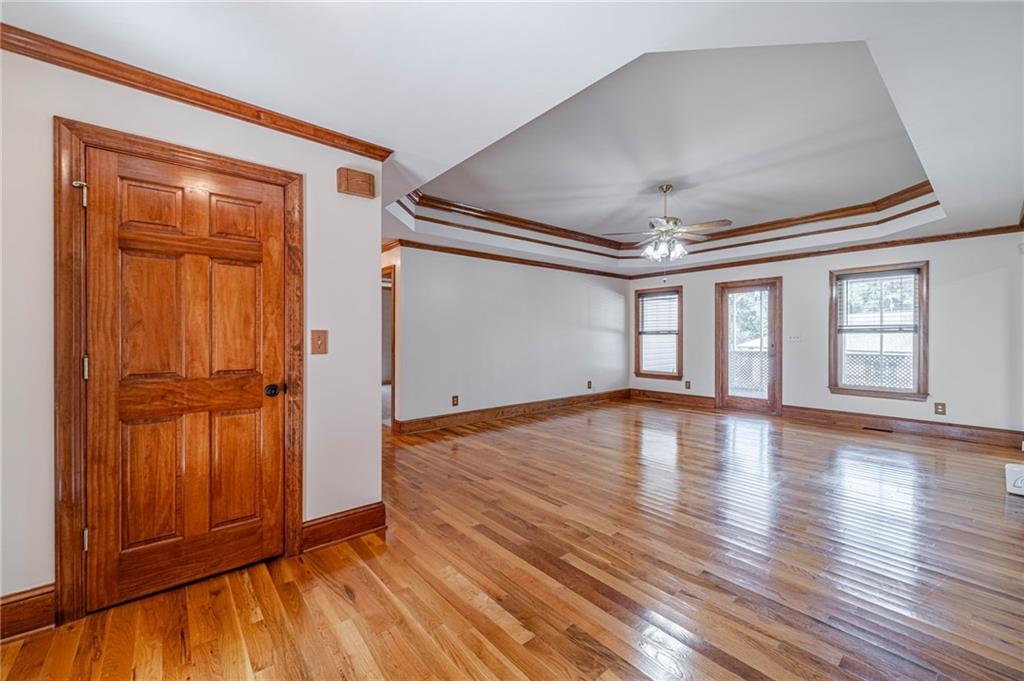2705 Luke Edwards Road Dacula, GA 30019 - Photo 24 of 74 a view of empty room with wooden floor and fan