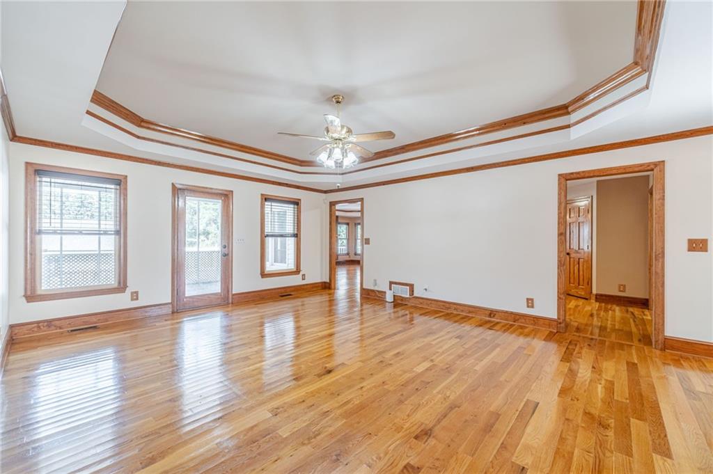 2705 Luke Edwards Road Dacula, GA 30019 - Photo 26 of 74 a view of empty room with wooden floor and fan