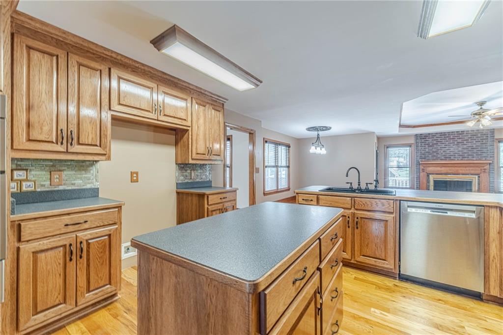 2705 Luke Edwards Road Dacula, GA 30019 - Photo 32 of 74 a kitchen with kitchen island a large counter top space and stainless steel appliances