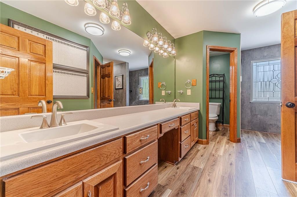 2705 Luke Edwards Road Dacula, GA 30019 - Photo 46 of 74 a spacious bathroom with a granite countertop sink a mirror and a shower