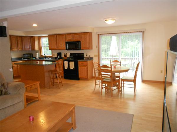 362 Simonds Road Ashby, MA 01431 - Photo 3 of 14 a dining room with furniture a window and appliances