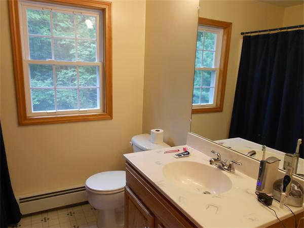 362 Simonds Road Ashby, MA 01431 - Photo 9 of 14 a bathroom with a sink a toilet and a mirror