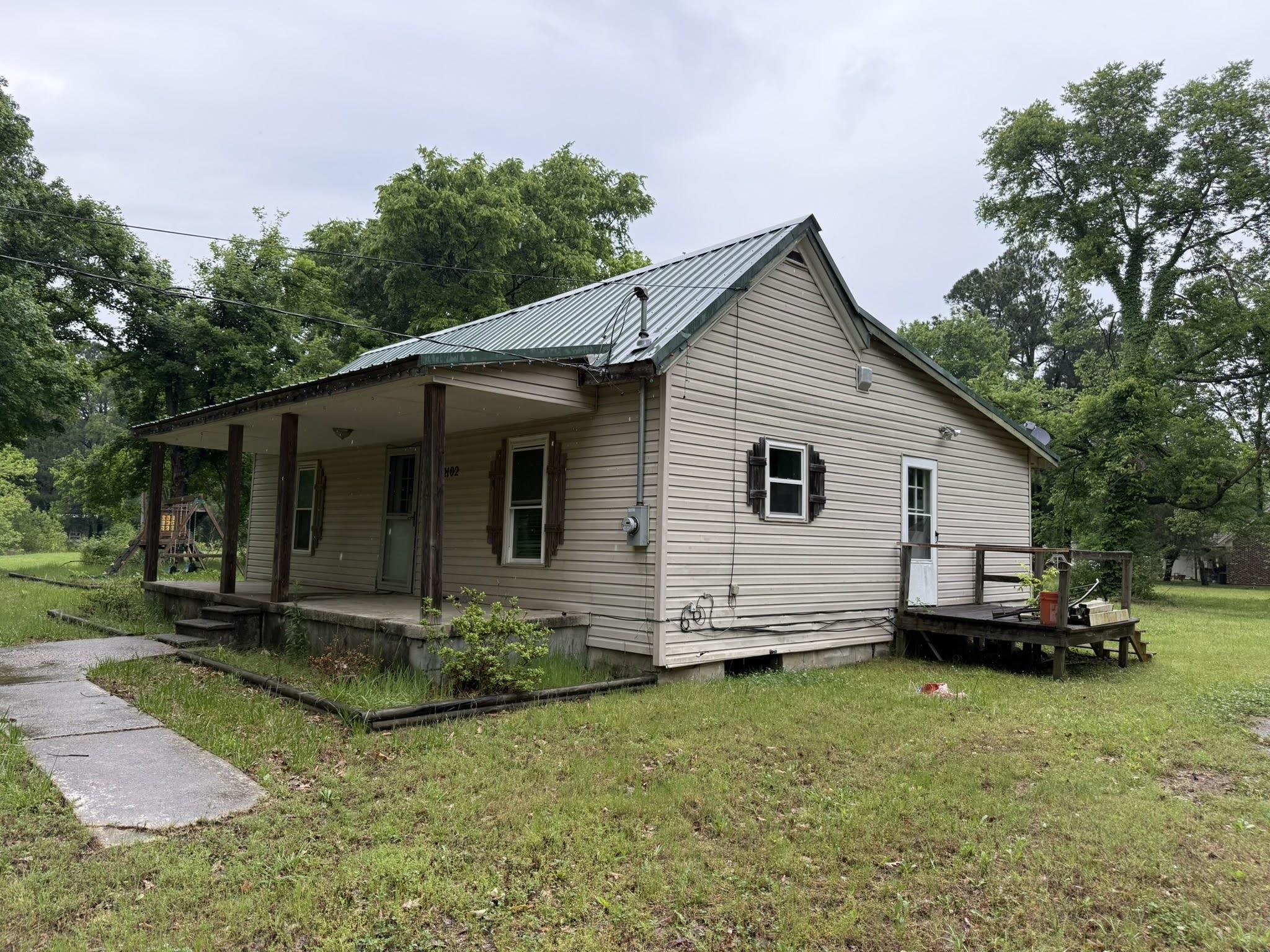 2102 Campbell Road Millington, TN 38053 - Photo 11 of 18 Cottage-style residence featuring a metal roof, siding exterior, and a covered front porch with four columns