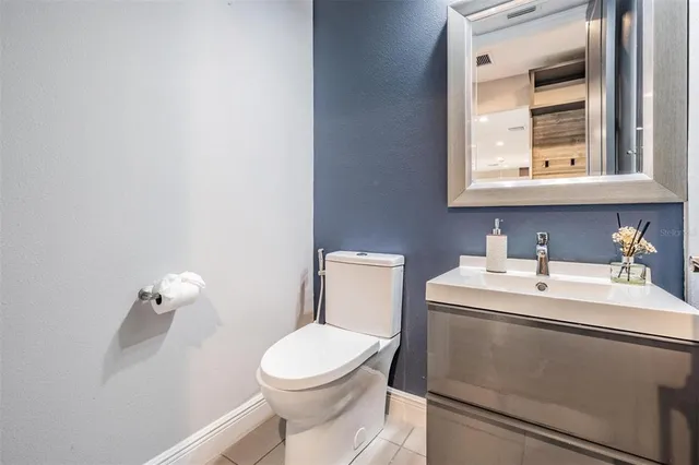 a view of a hallway with wooden floor and dining room
