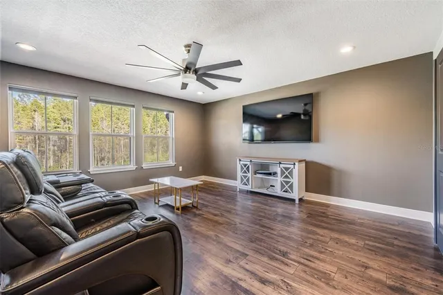 a spacious bedroom with a bed and a large window