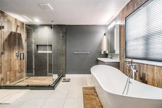 a bathroom with a bathtub and a shower