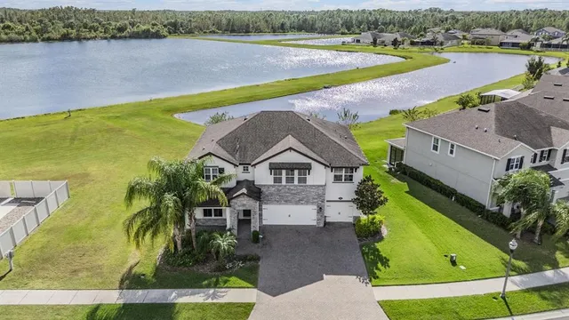 an aerial view of a house with a swimming pool