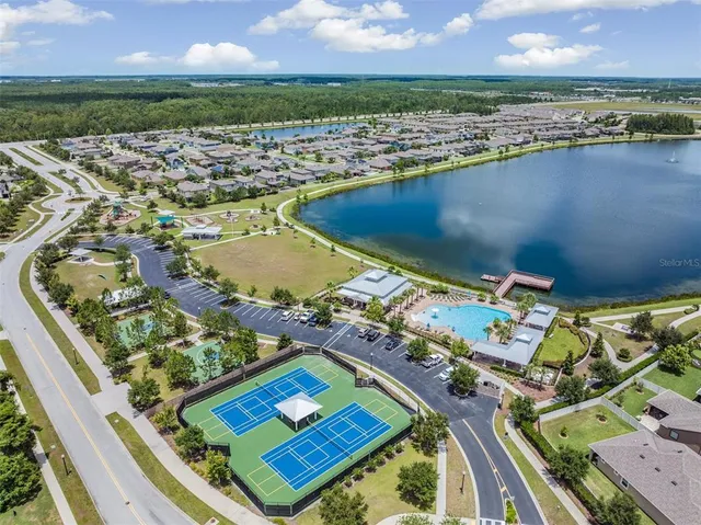 an aerial view of swimming pool with a balcony