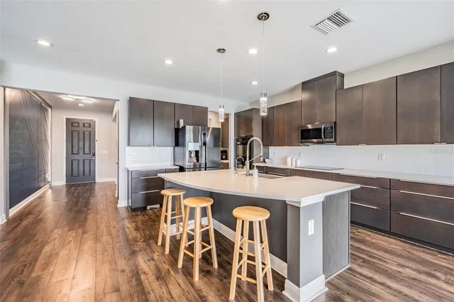 a large kitchen with cabinets
