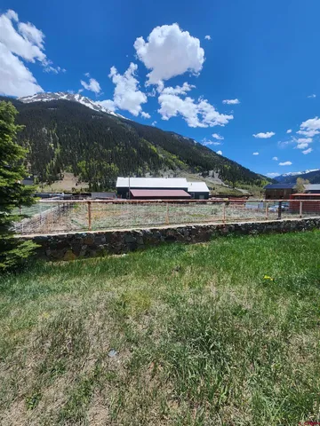 a view of a house with a big yard