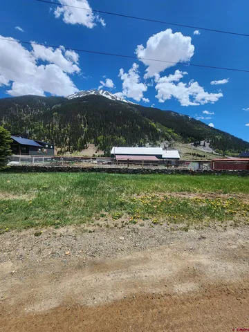 a view of a swimming pool with a yard