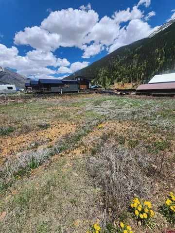 a view of a room with a chandelier and fireplace