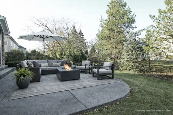 a view of a patio with couches and potted plants