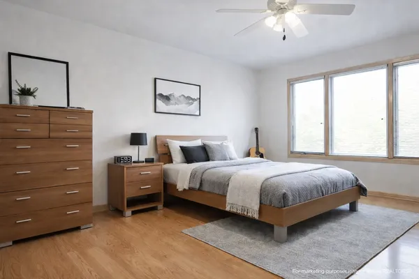 a bedroom with a bed and a dresser