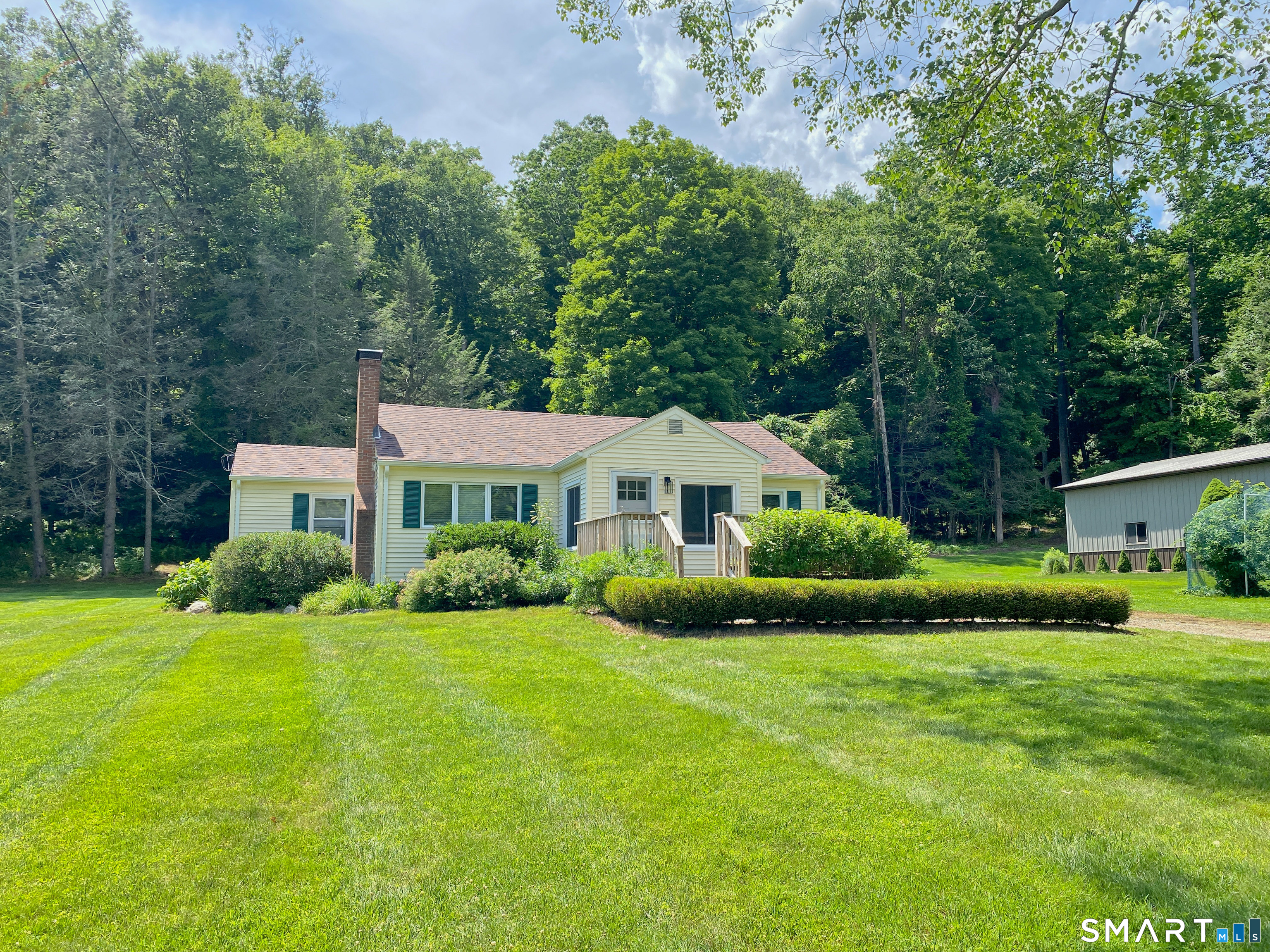 5 R Broad Hill Road Granby, CT 06090 - Photo 30 of 31 a view of a house with a big yard and large trees
