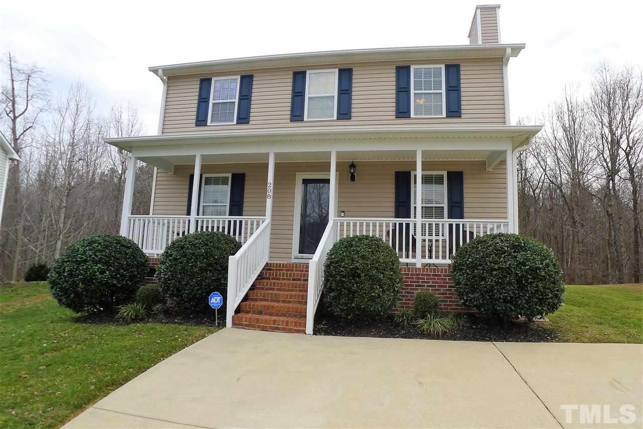 208 Muirfield Ridge Drive Garner, NC 27529 - Photo 1 of 30 a front view of a house with a yard