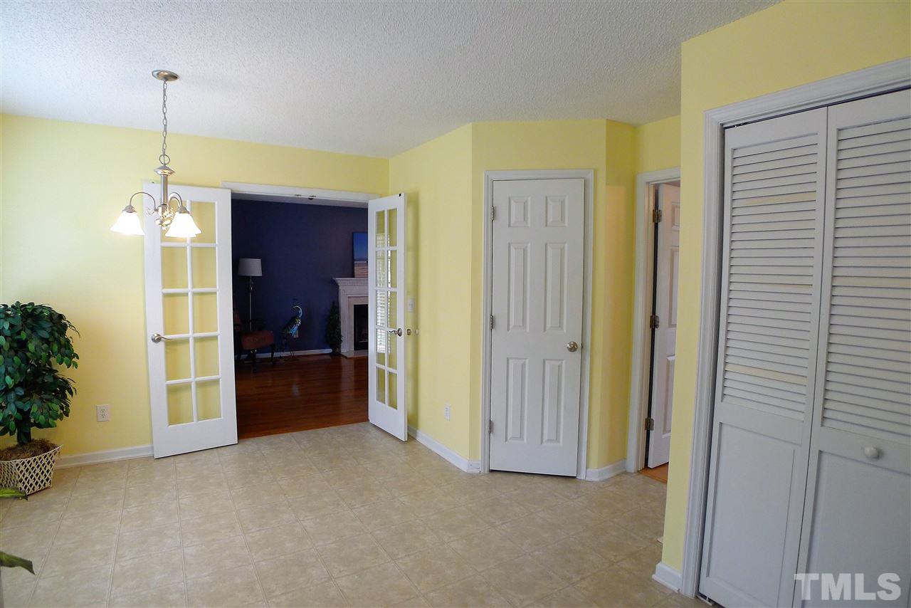 208 Muirfield Ridge Drive Garner, NC 27529 - Photo 13 of 30 a view of empty room with a door