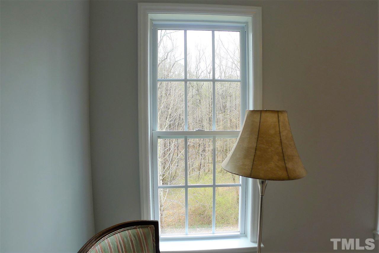 208 Muirfield Ridge Drive Garner, NC 27529 - Photo 18 of 30 a bathroom with a window and a lamp
