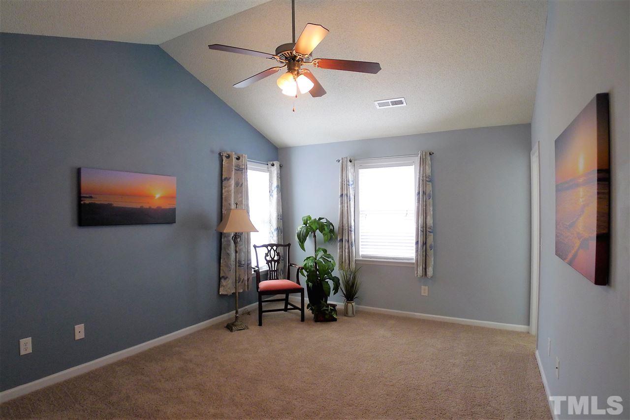 208 Muirfield Ridge Drive Garner, NC 27529 - Photo 20 of 30 a living room with furniture and a window