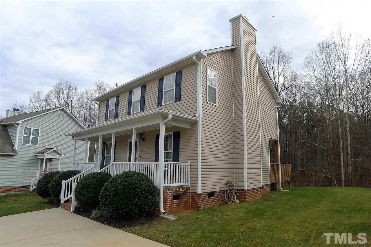 208 Muirfield Ridge Drive Garner, NC 27529 - Photo 3 of 30 a front view of a house with garden