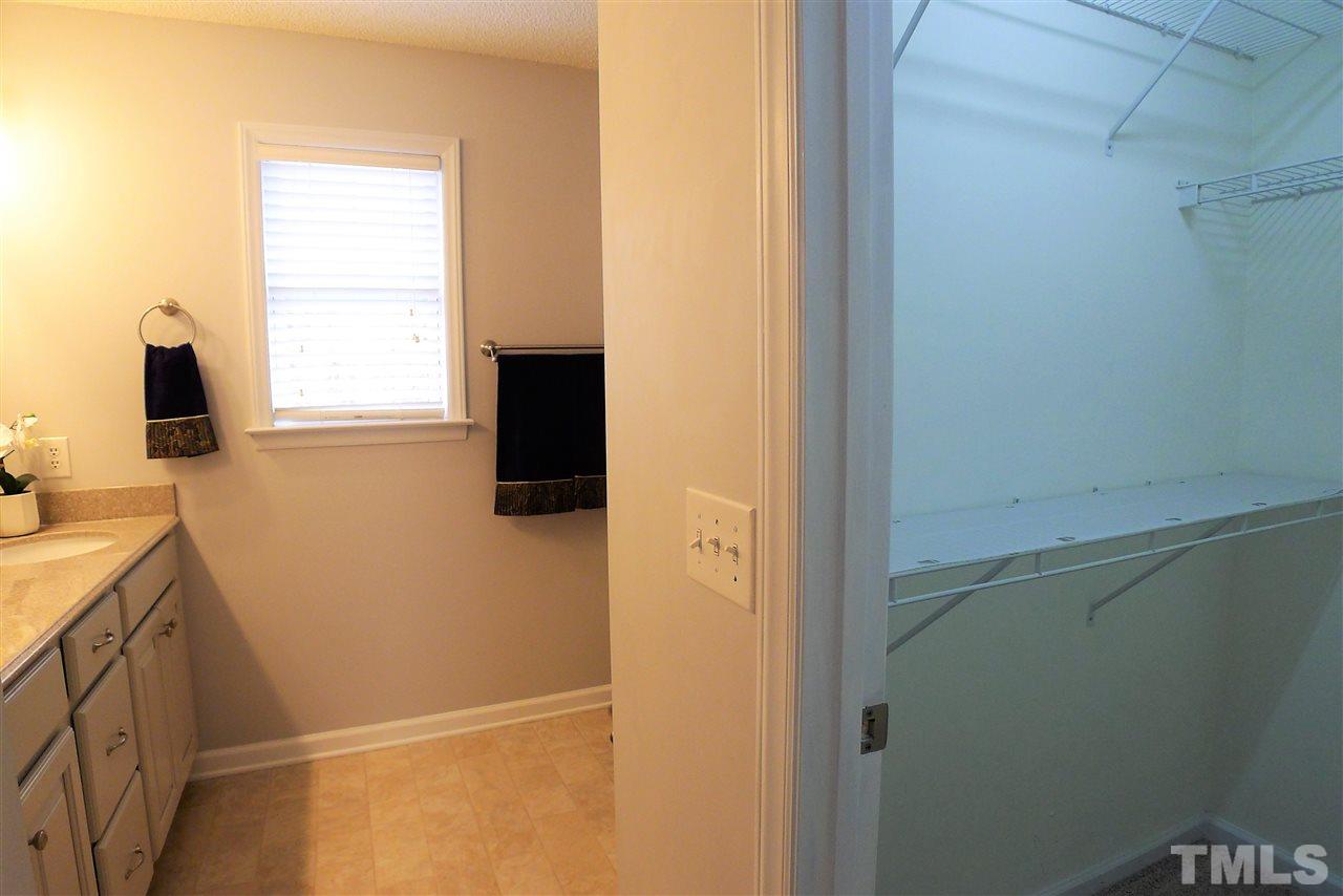 208 Muirfield Ridge Drive Garner, NC 27529 - Photo 23 of 30 a bathroom with a sink and a window