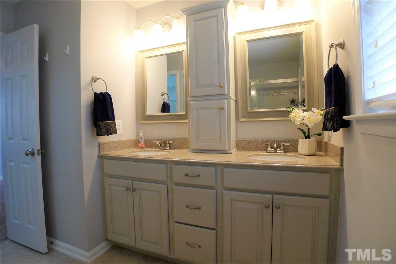 208 Muirfield Ridge Drive Garner, NC 27529 - Photo 26 of 30 a bathroom with a double vanity sink and mirror