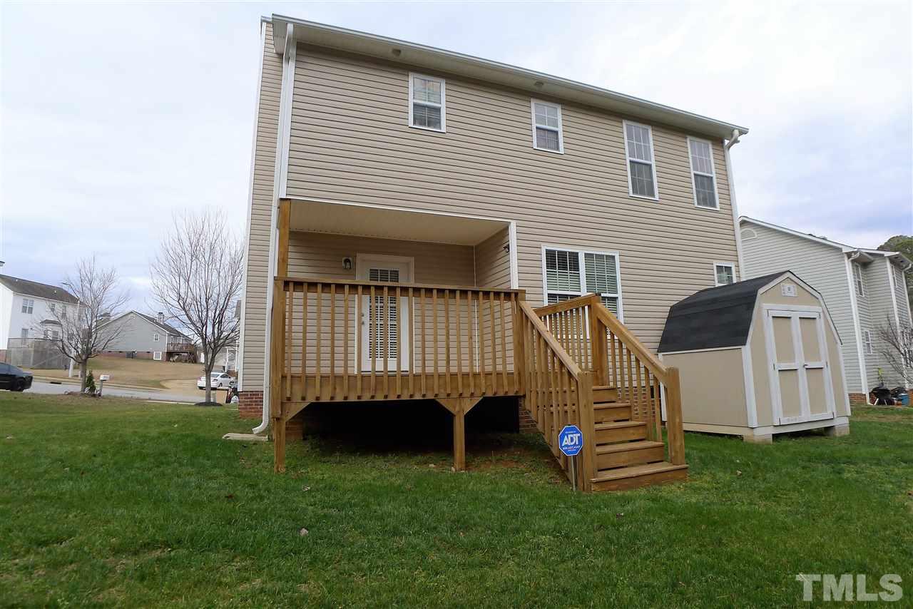 208 Muirfield Ridge Drive Garner, NC 27529 - Photo 27 of 30 a view of backyard with a garden and deck