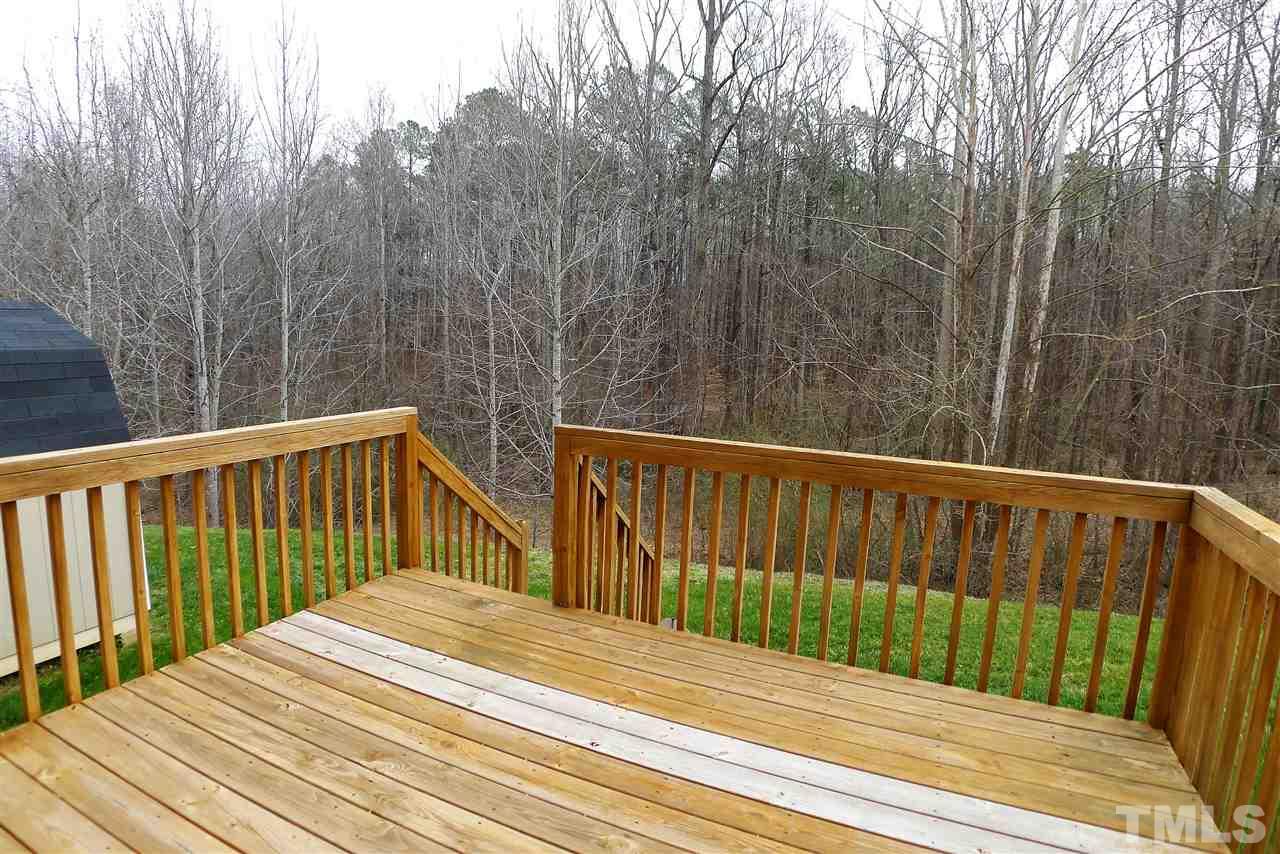 208 Muirfield Ridge Drive Garner, NC 27529 - Photo 29 of 30 a view of a wooden roof deck