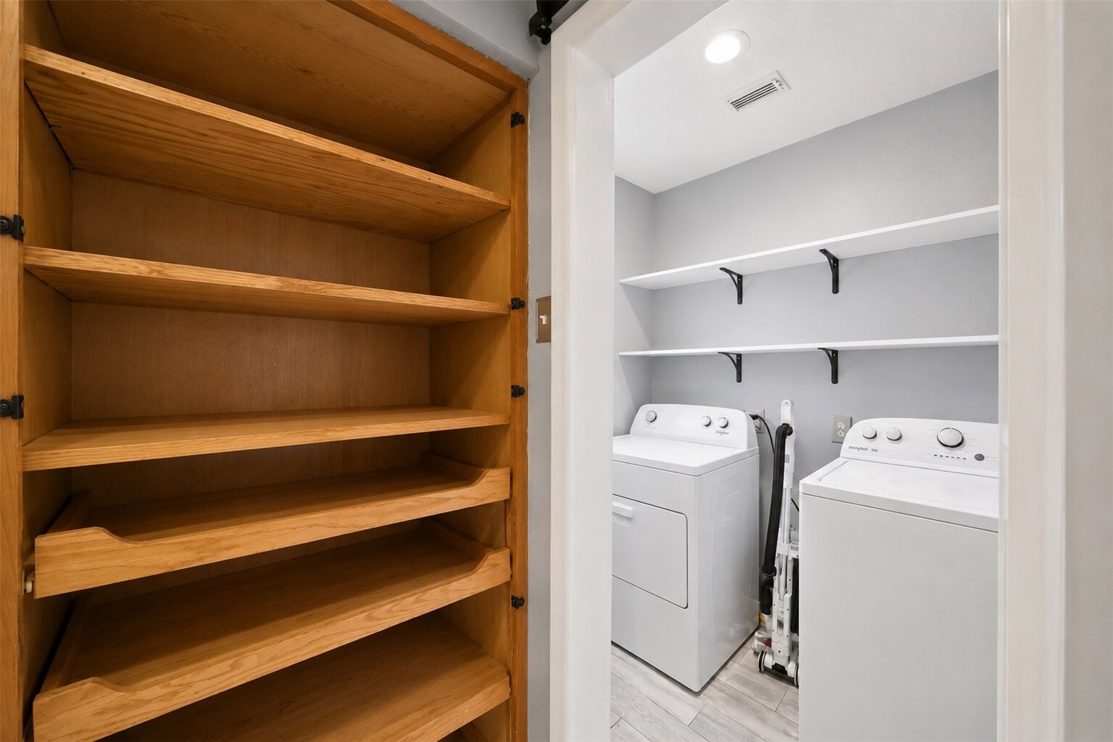 1306 Camden Road Pasadena, TX 77502 - Photo 9 of 16 Convenient interior utility room with washer and dryer hookups, built in shelving for extra storage, and a large pantry style cabinet right next door!