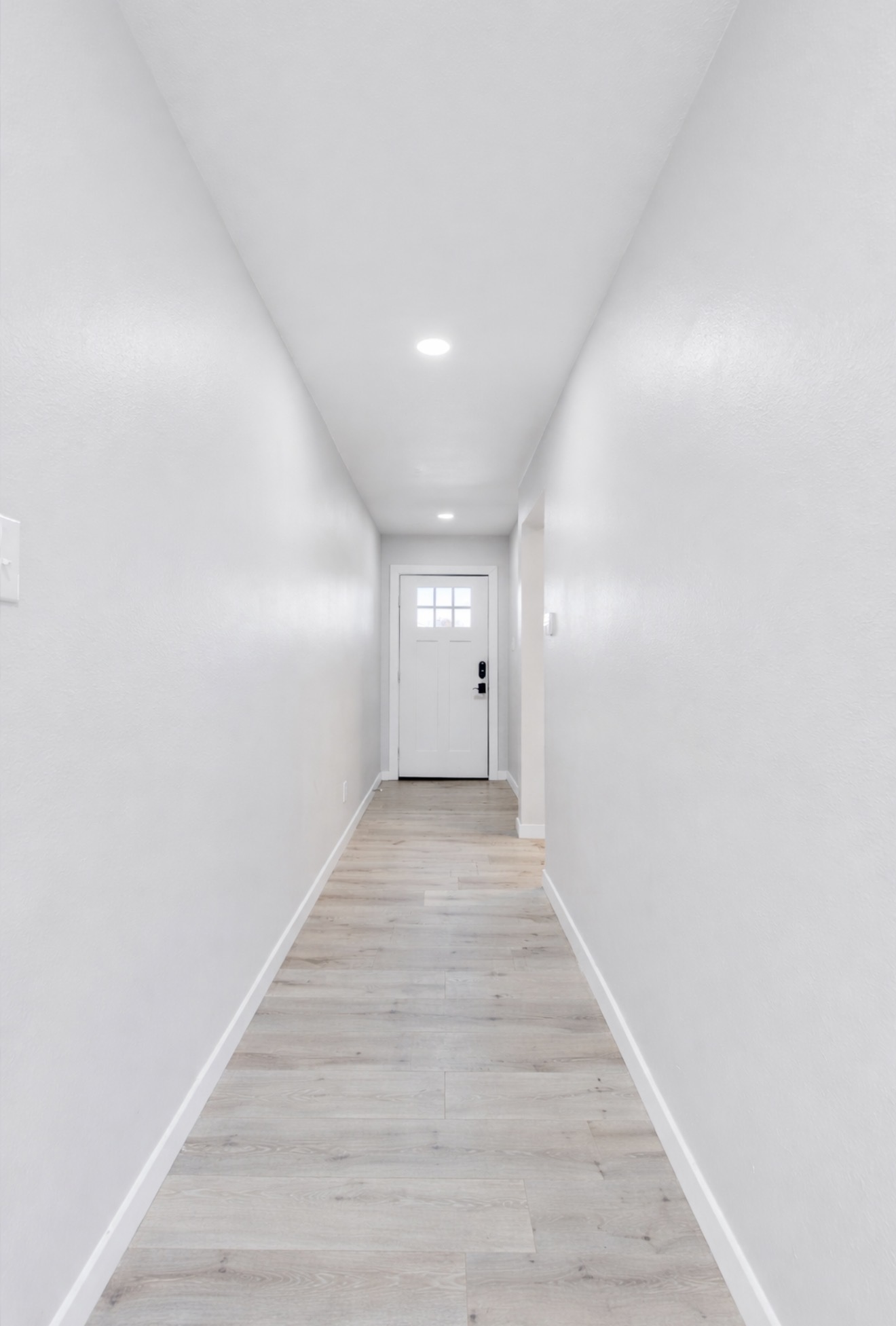 313 Drystone Trail Liberty Hill, TX 78642 - Photo 2 of 17 Doorway with wood finished floors and baseboards