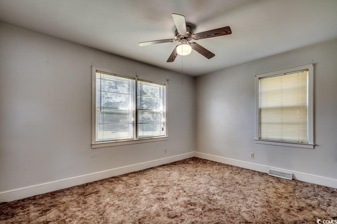 4278 Thomas Street Loris, SC 29569 - Photo 12 of 24 Empty room featuring carpet and ceiling fan