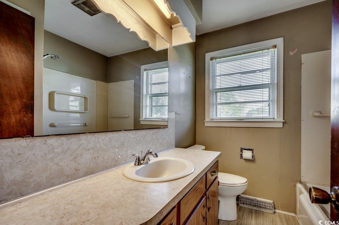 4278 Thomas Street Loris, SC 29569 - Photo 14 of 24 Full bathroom featuring vanity, hardwood / wood-st