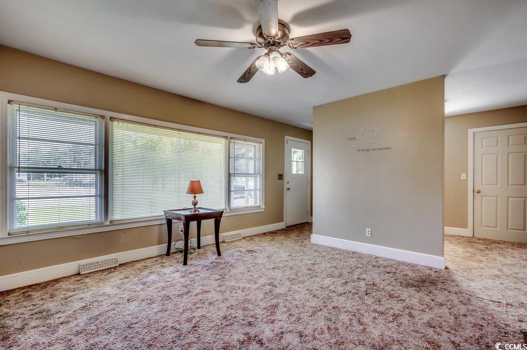 4278 Thomas Street Loris, SC 29569 - Photo 2 of 24 Carpeted spare room with ceiling fan