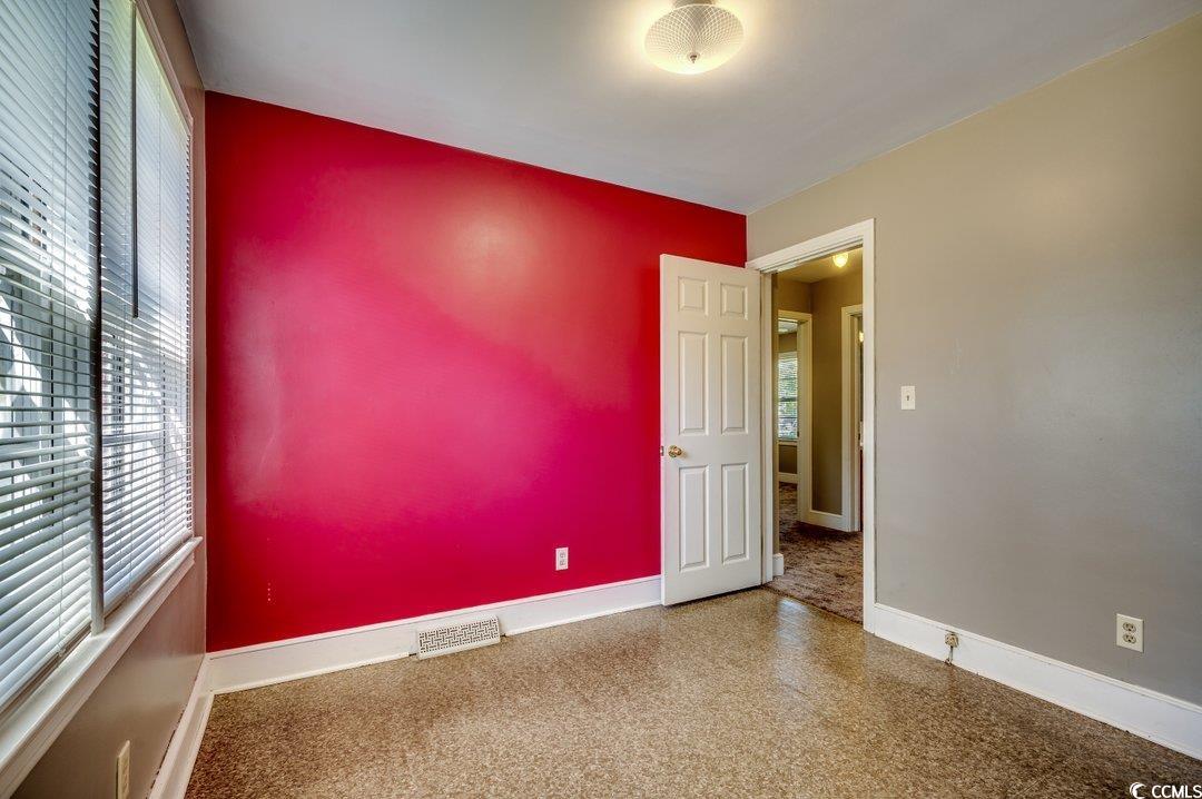4278 Thomas Street Loris, SC 29569 - Photo 10 of 24 Empty room featuring a wealth of natural light