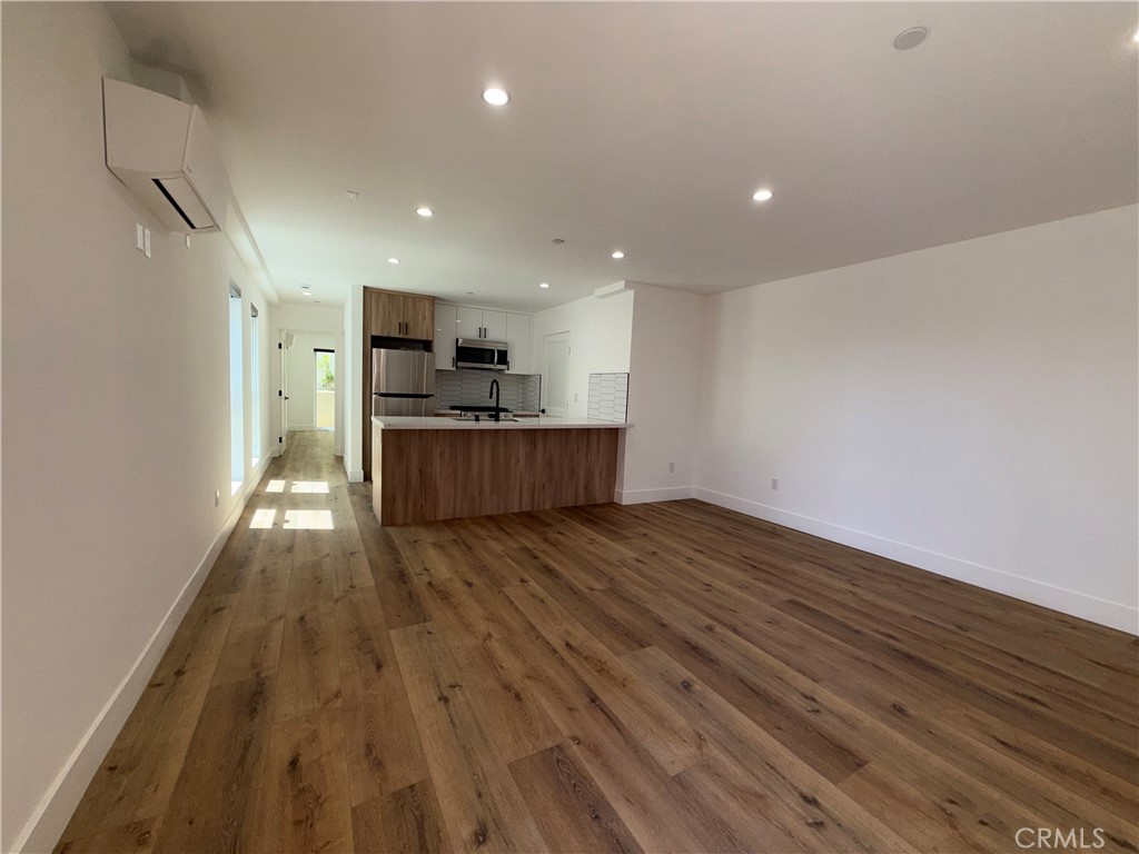 4454 Clinton Street, Unit 1/2 Los Angeles, CA 90004 - Photo 4 of 12 a view of kitchen and wooden floor