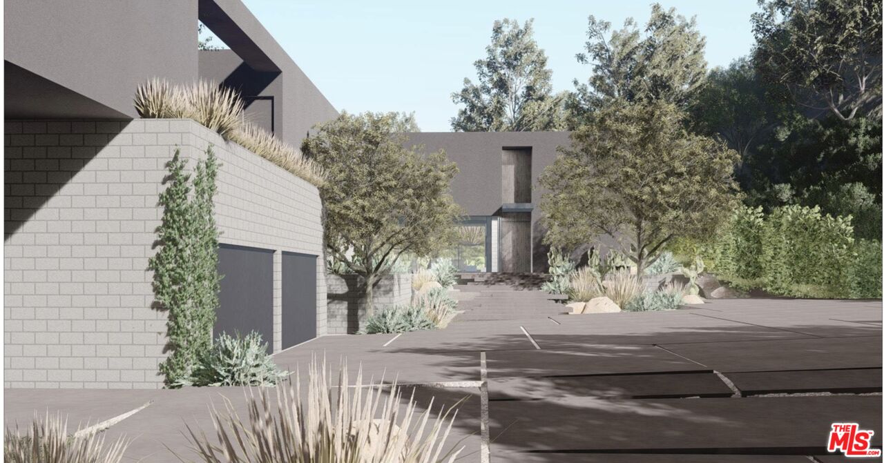 3375 Mandeville Canyon Road Los Angeles, CA 90049 - Photo 11 of 13 a backyard of a house with large trees and plants