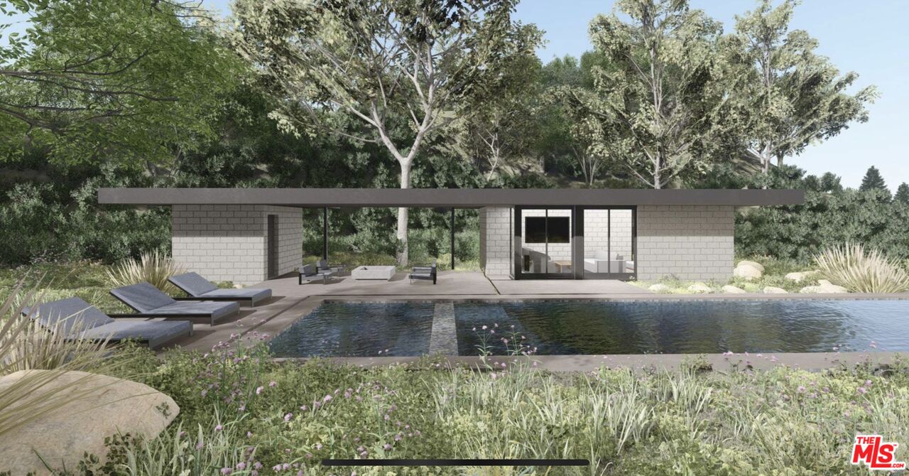 3375 Mandeville Canyon Road Los Angeles, CA 90049 - Photo 9 of 13 front view of house with a yard