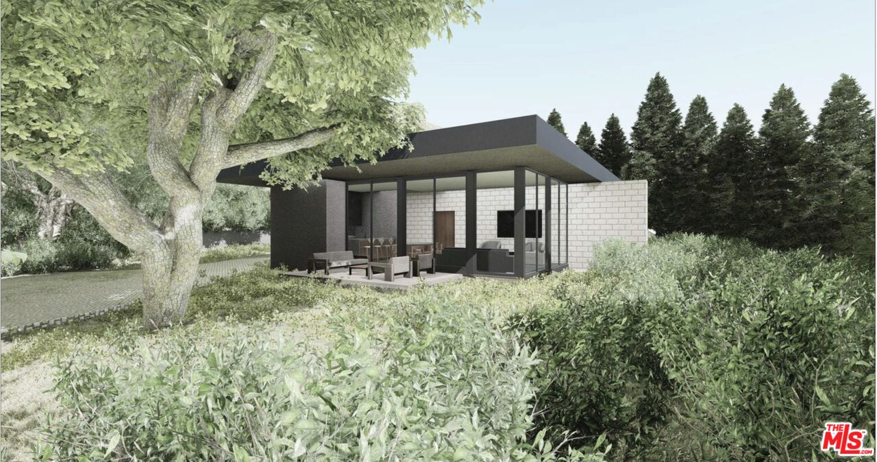 3375 Mandeville Canyon Road Los Angeles, CA 90049 - Photo 10 of 13 a front view of house with yard and trees around