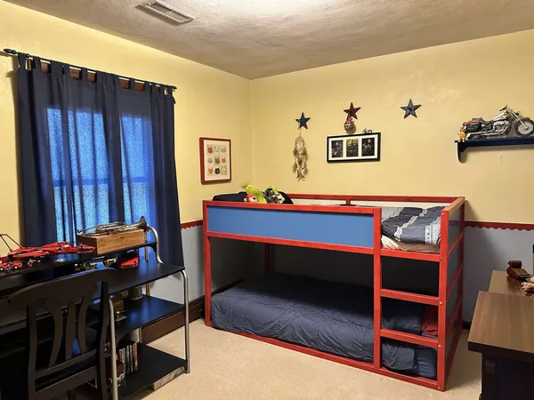 a room with furniture and musical instruments
