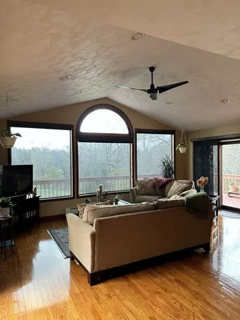 a living room with furniture and a large window