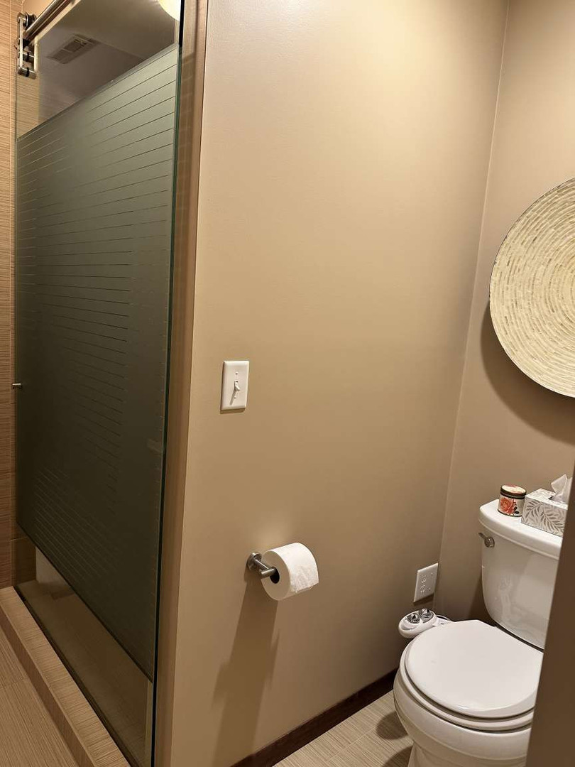 11 Marty Lane Macomb, IL 61455 - Photo 10 of 25 a white toilet sitting next to a shower