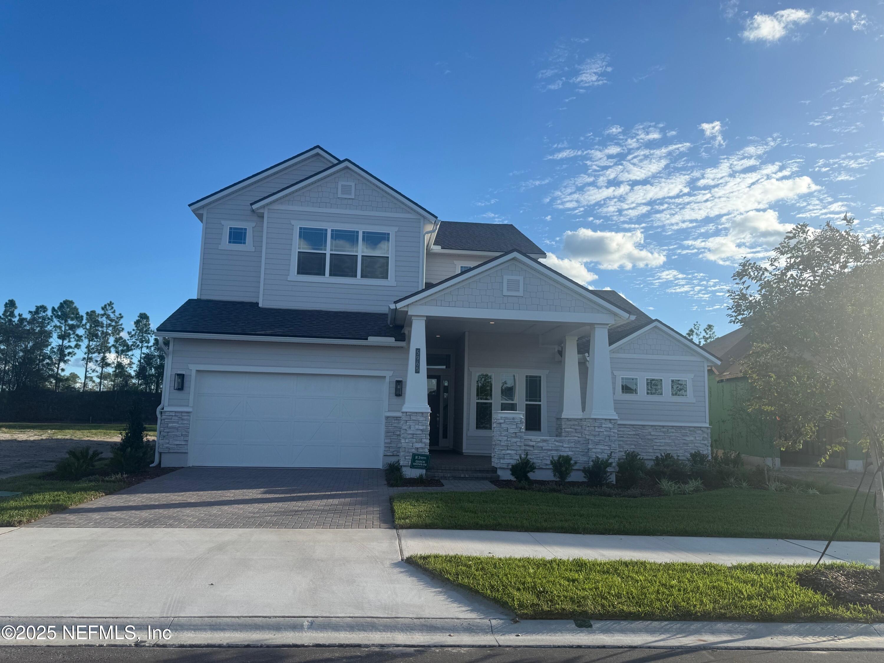 5965 Timber Pines Road Jacksonville, FL 32224 - Photo 1 of 1 a front view of a house with a yard and garage